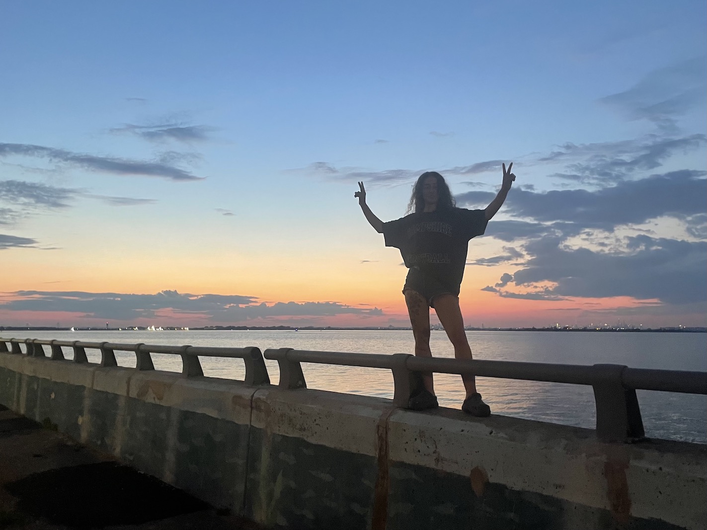 Margaret in front of a Rockaway sunset